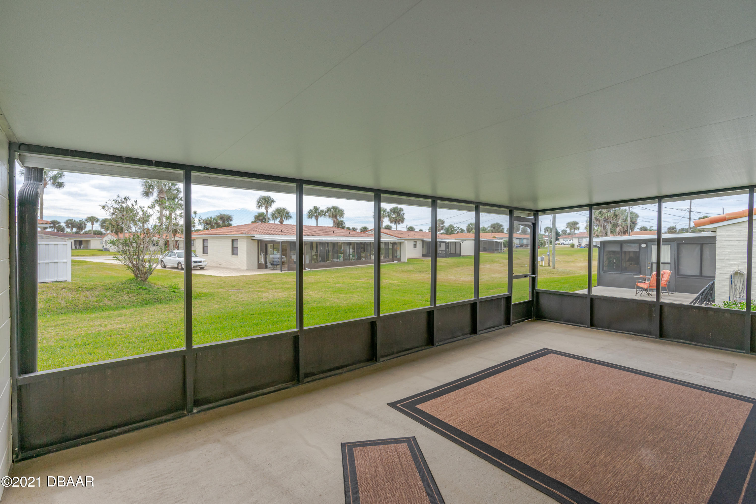 202 Northshore Drive, Unit B Ormond Beach, FL 32176 - Photo 6 of 25 an empty room with sliding door