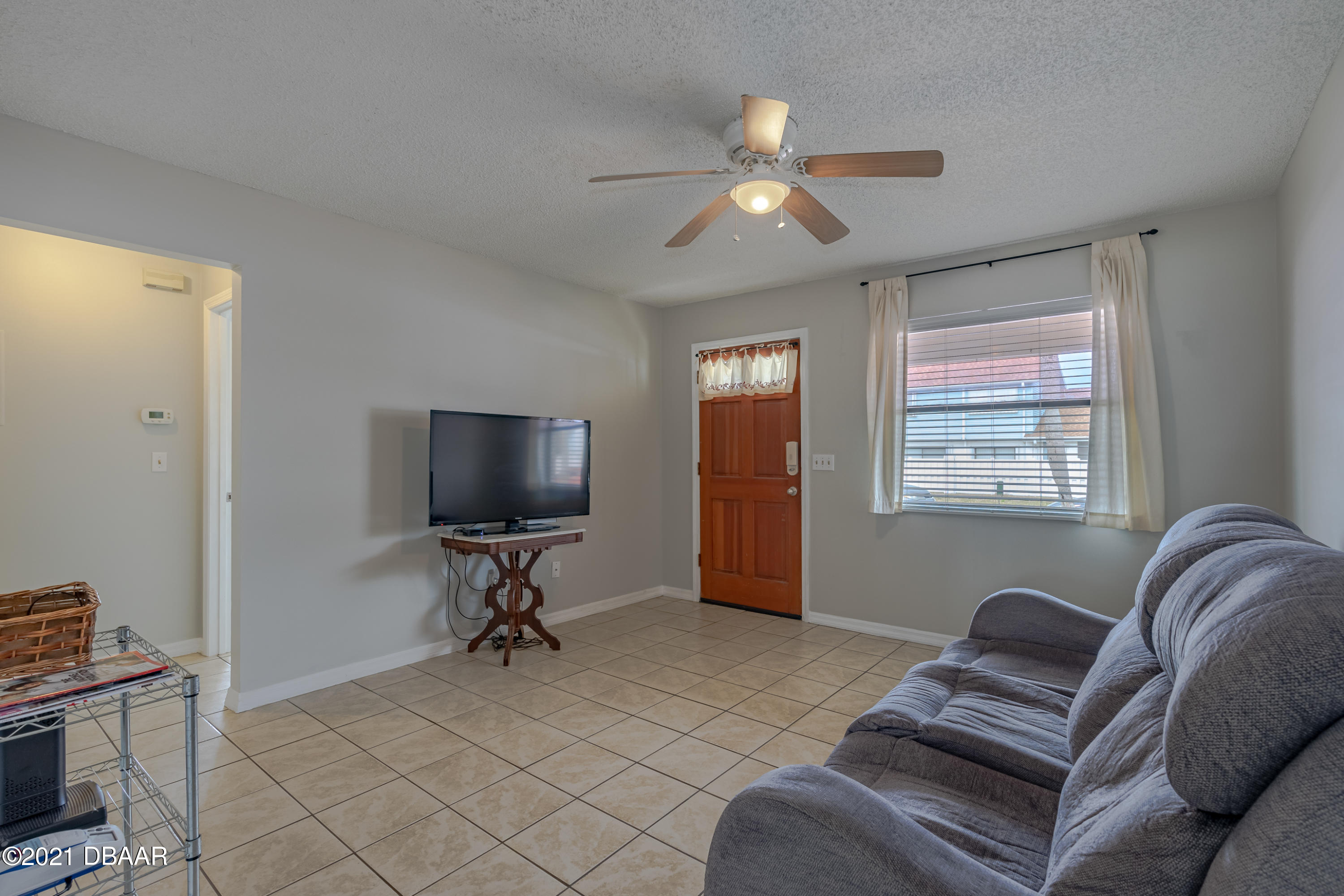202 Northshore Drive, Unit B Ormond Beach, FL 32176 - Photo 9 of 25 a living room with furniture and a window