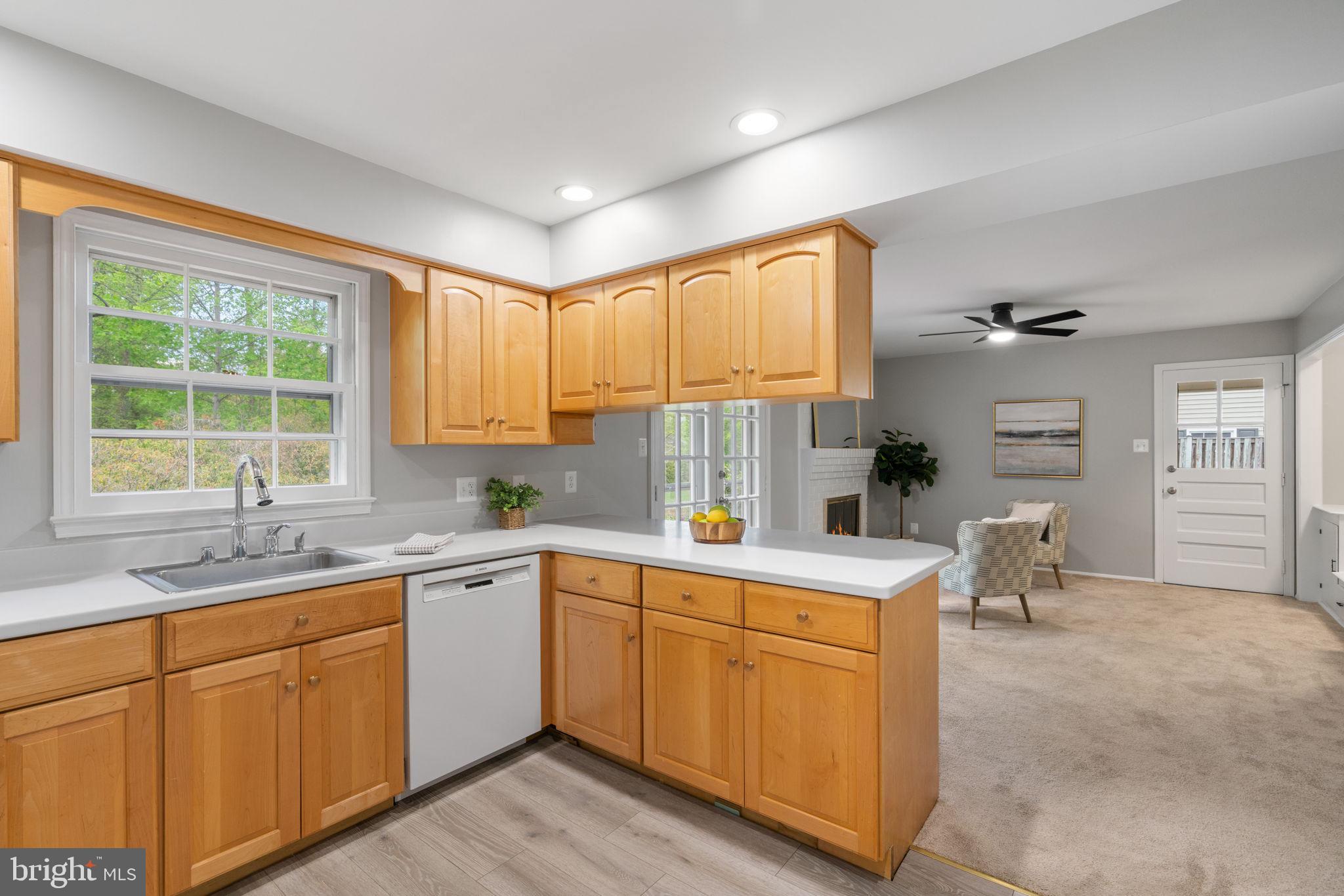 8328 Carrleigh Parkway Springfield, VA 22152 - Photo 13 of 58 a kitchen with a sink cabinets and window