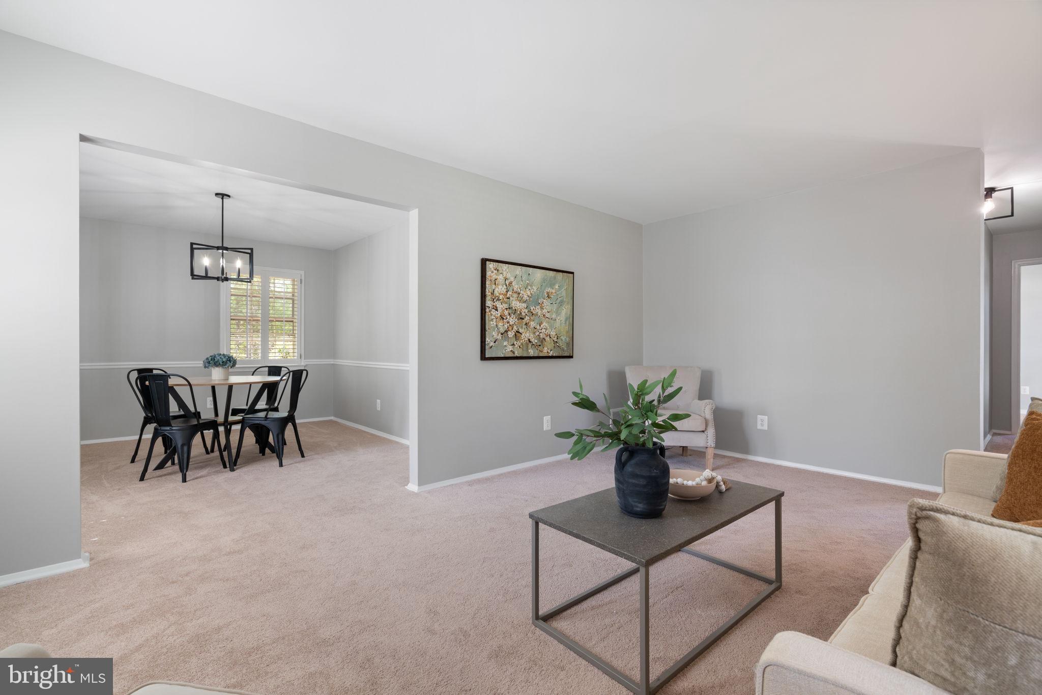 8328 Carrleigh Parkway Springfield, VA 22152 - Photo 19 of 58 a view of a livingroom with furniture and a potted plant