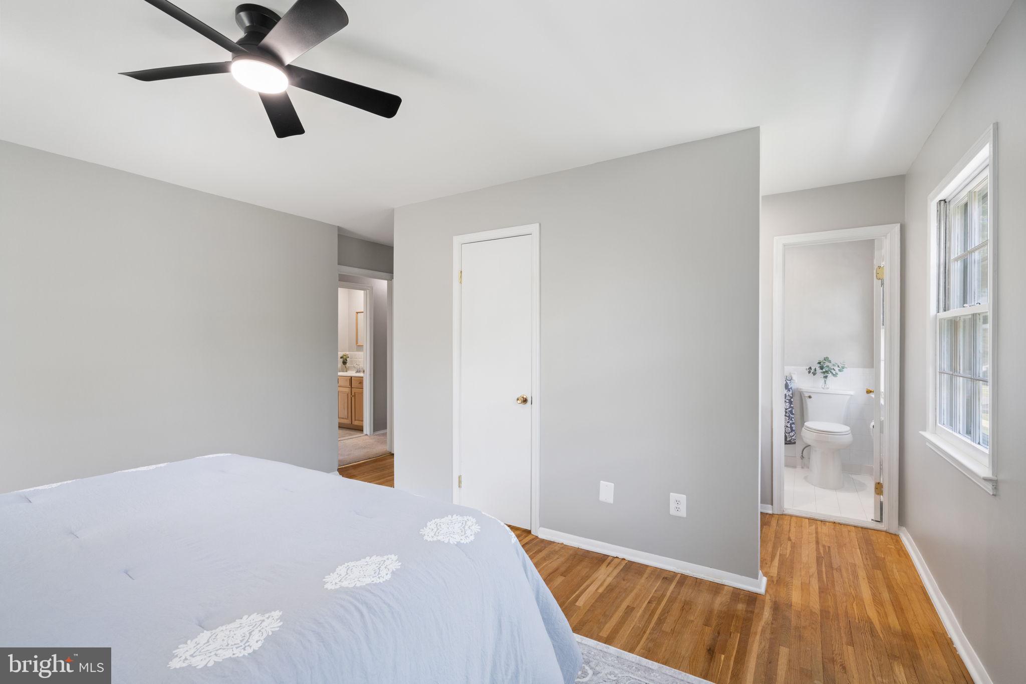 8328 Carrleigh Parkway Springfield, VA 22152 - Photo 24 of 58 a bedroom with a bed and a dresser