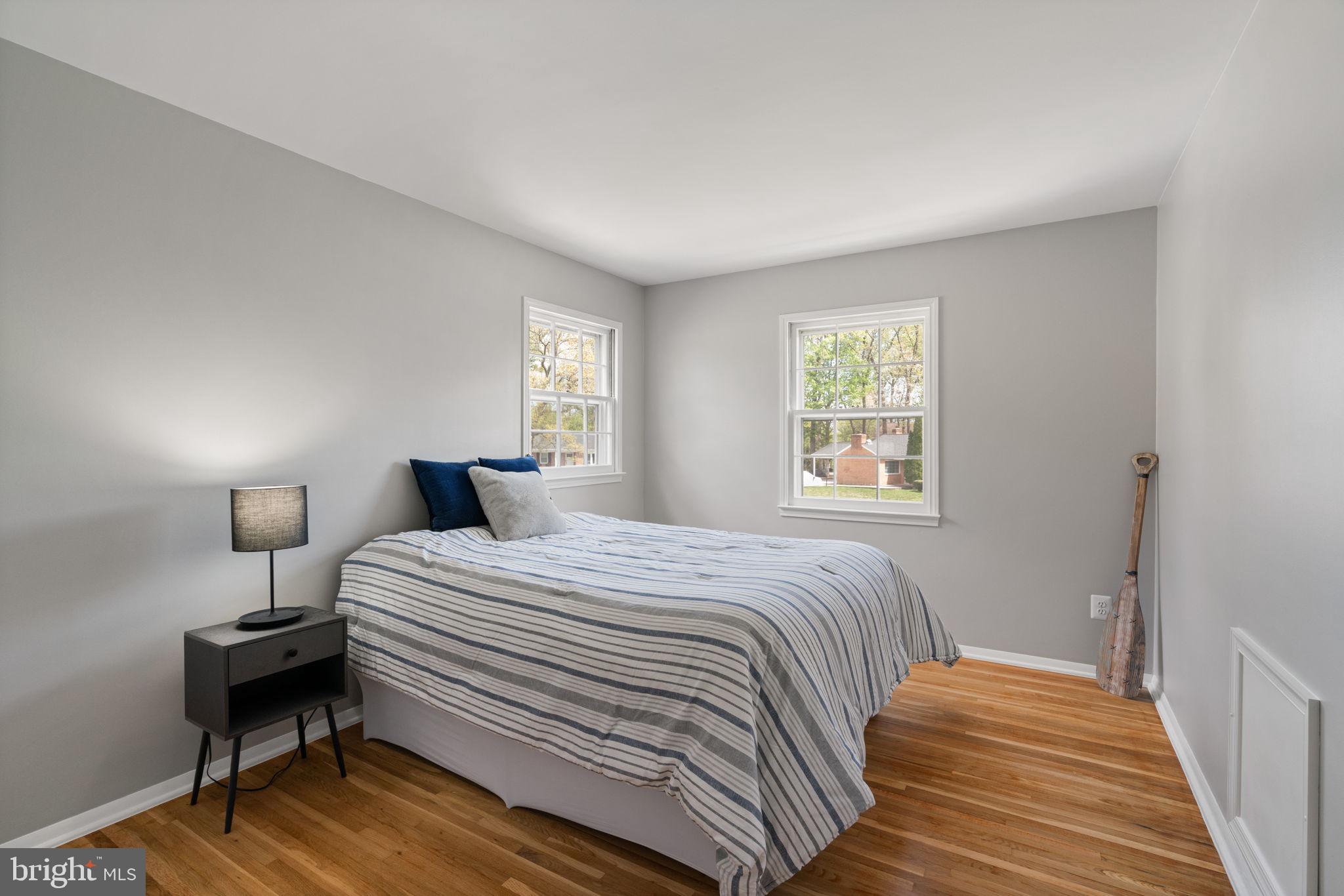 8328 Carrleigh Parkway Springfield, VA 22152 - Photo 30 of 58 a bedroom with a bed and a window