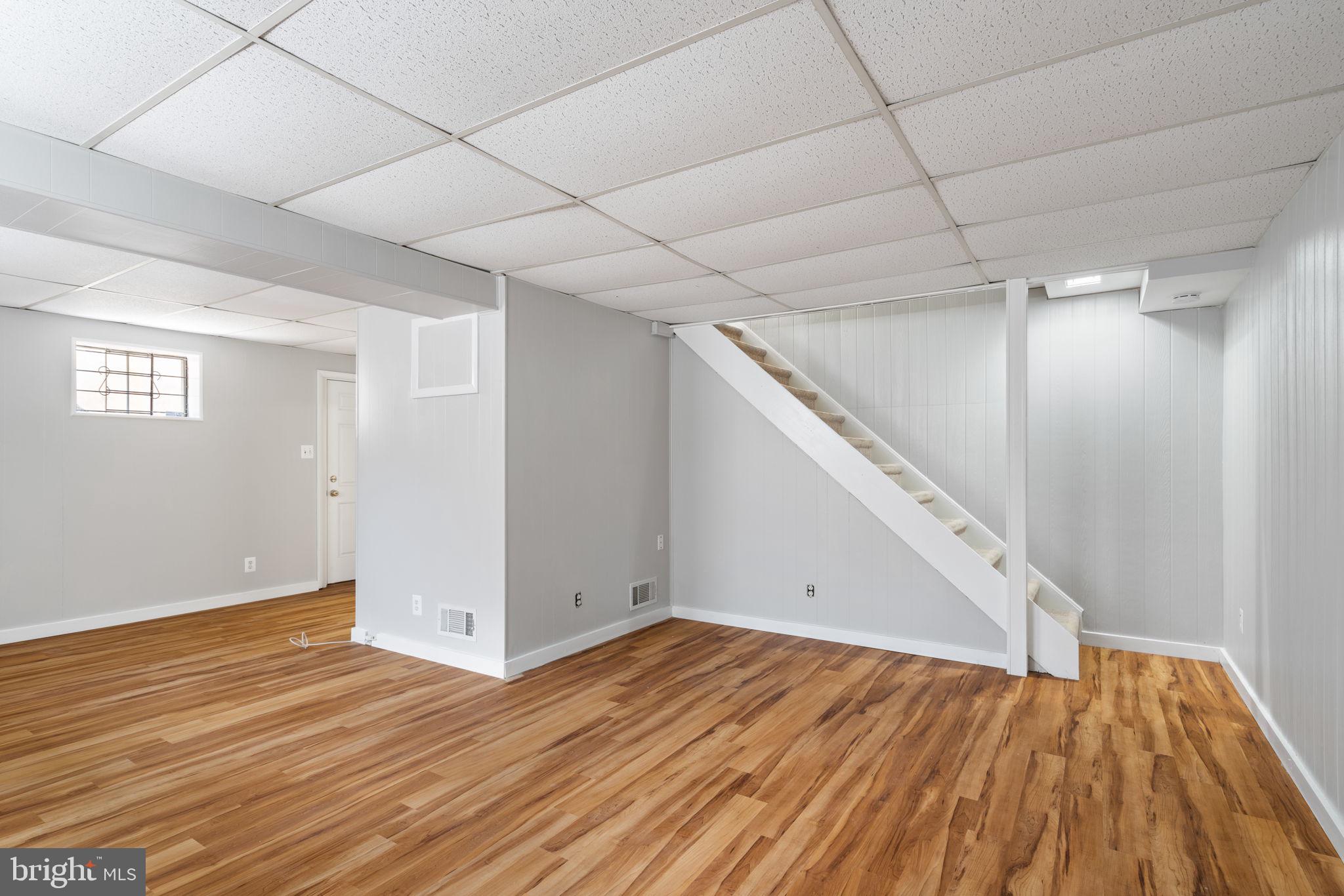 8328 Carrleigh Parkway Springfield, VA 22152 - Photo 36 of 58 a view of empty room with wooden floor