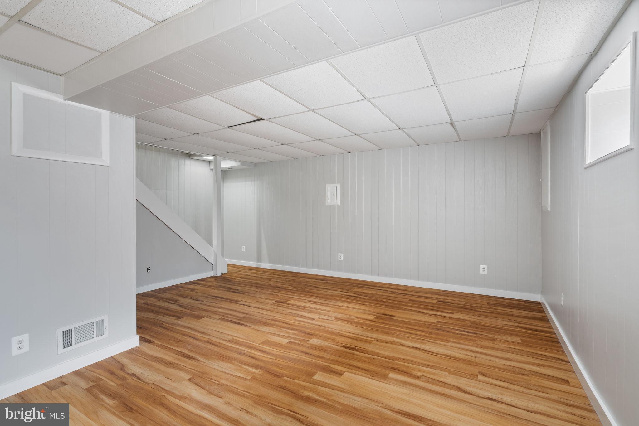 8328 Carrleigh Parkway Springfield, VA 22152 - Photo 37 of 58 a view of empty room with wooden floor