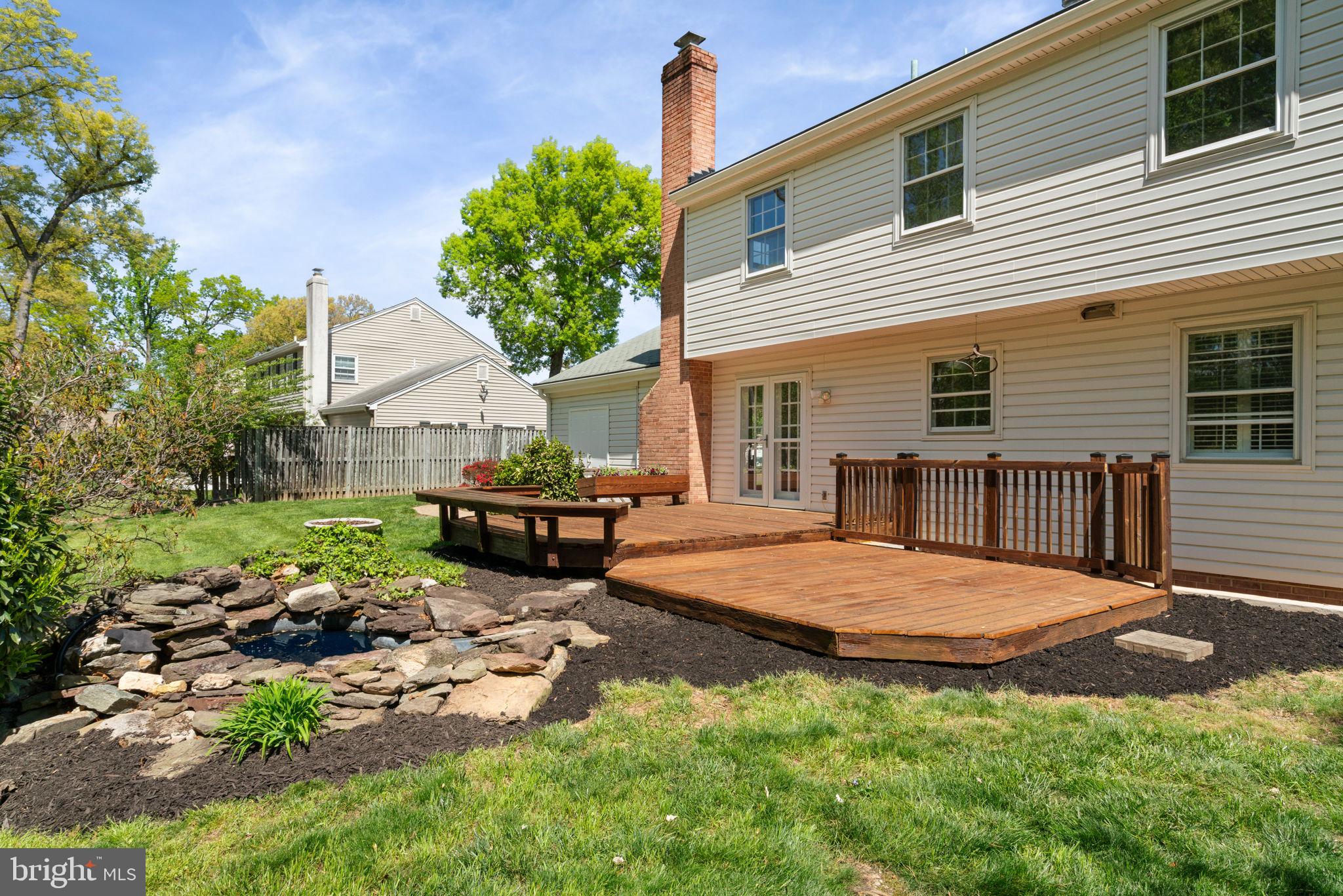 8328 Carrleigh Parkway Springfield, VA 22152 - Photo 47 of 58 a view of a house with backyard and a patio