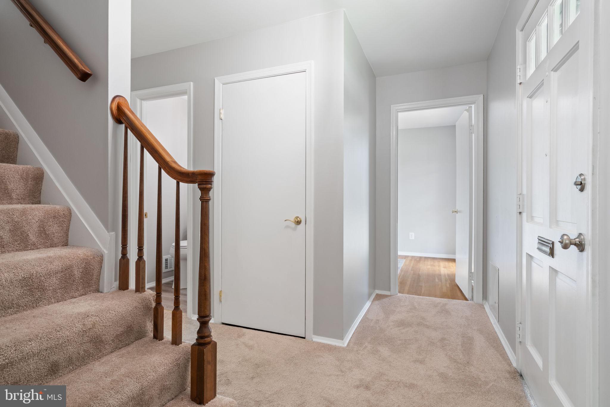 8328 Carrleigh Parkway Springfield, VA 22152 - Photo 6 of 58 a view of a livingroom with stairs and furniture