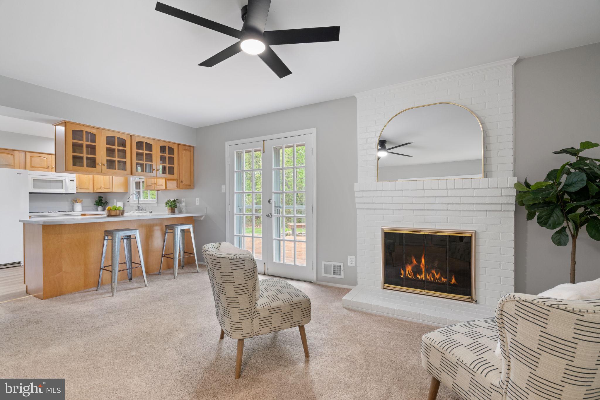 8328 Carrleigh Parkway Springfield, VA 22152 - Photo 9 of 58 a living room with furniture and a fireplace
