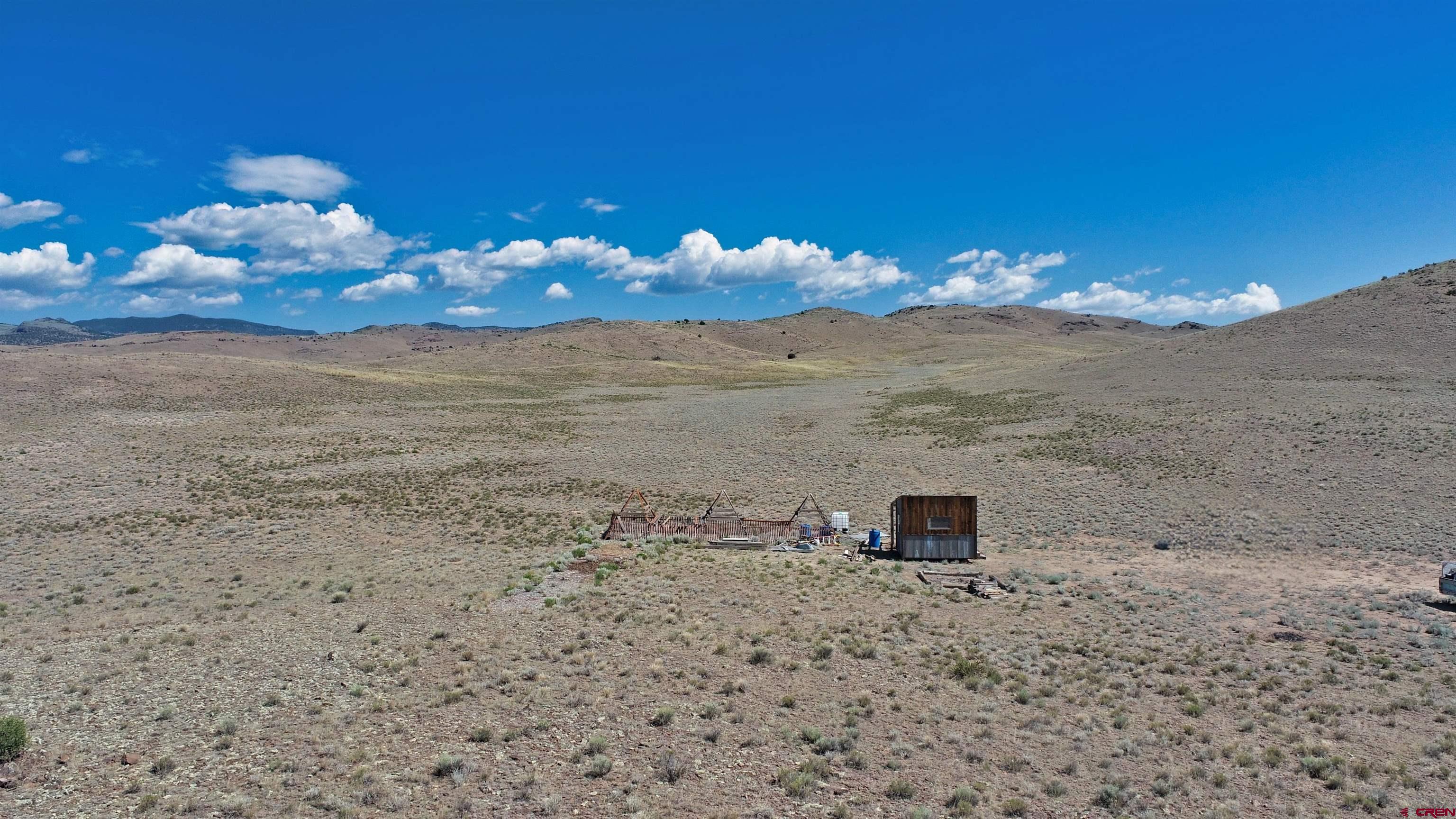 0 Tbd Del Norte, CO 81132 - Photo 2 of 11 a view of a lake with a mountain