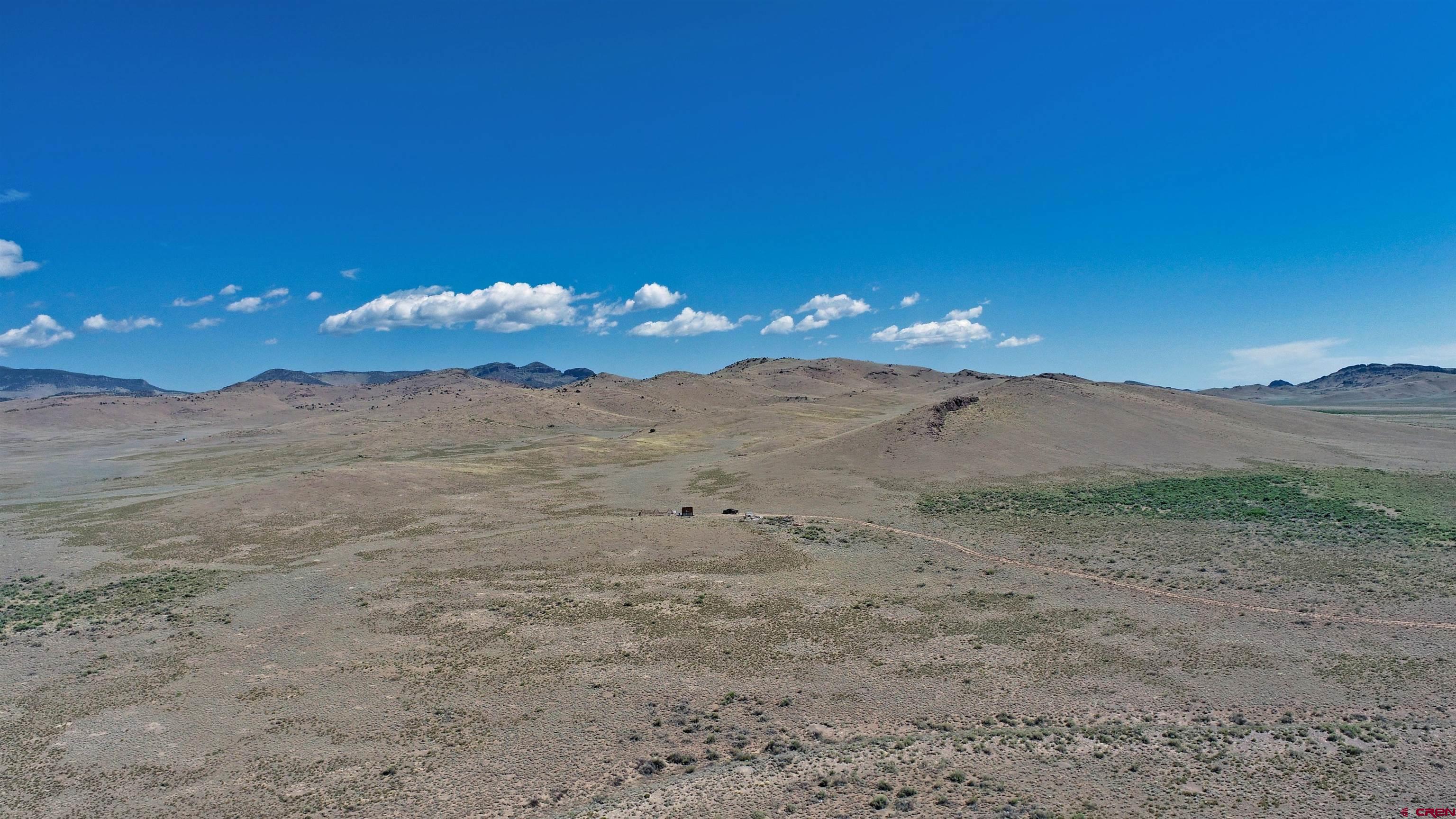 0 Tbd Del Norte, CO 81132 - Photo 3 of 11 a view of a big yard with mountain view and mountain view