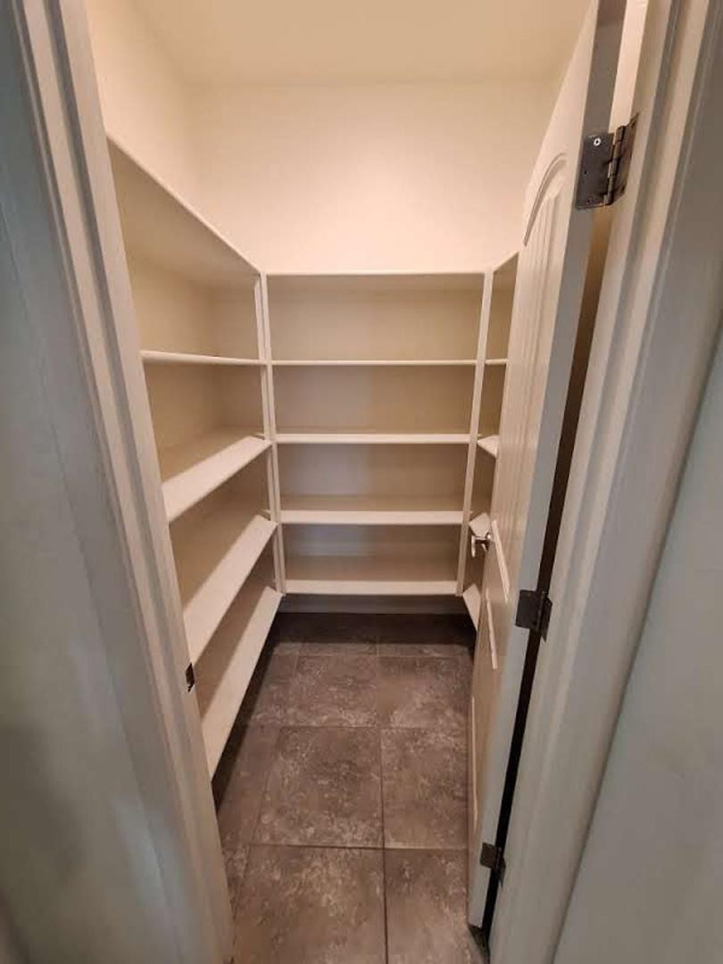 18541 West Mescal Street Surprise, AZ 85388 - Photo 13 of 31 a view of walk in closet with empty racks