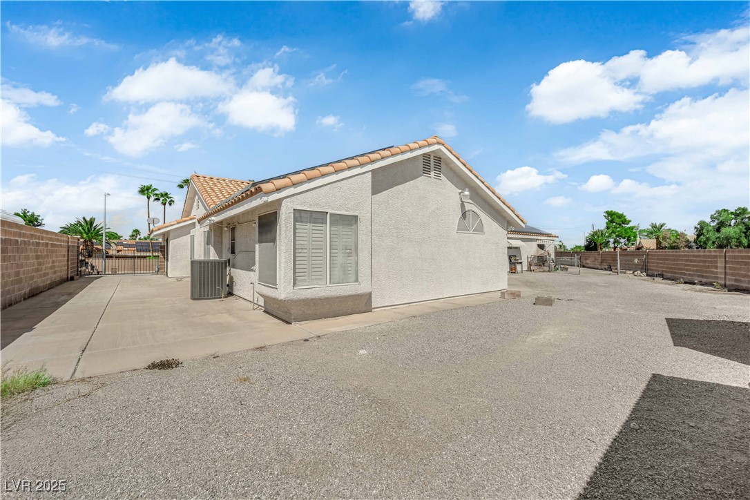 1637 East Robindale Road Las Vegas, NV 89123 - Photo 33 of 45 Back yard with RV parking on the left