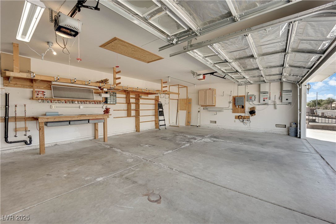 1637 East Robindale Road Las Vegas, NV 89123 - Photo 35 of 45 Garage featuring a garage door opener