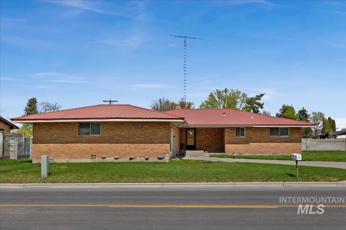 2012 21st Street Heyburn, ID 83336 - Photo 1 of 38 Ranch-style home featuring crawl space, brick siding, and a metal roof