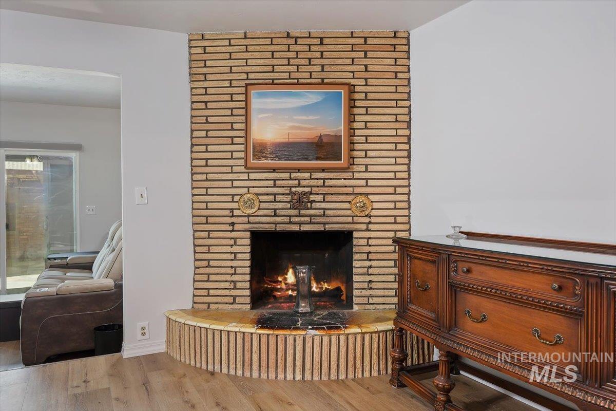 2012 21st Street Heyburn, ID 83336 - Photo 11 of 38 Detailed view of a fireplace and wood finished floors