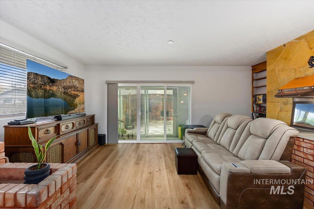 2012 21st Street Heyburn, ID 83336 - Photo 21 of 38 Living room with wood finished floors and built in features