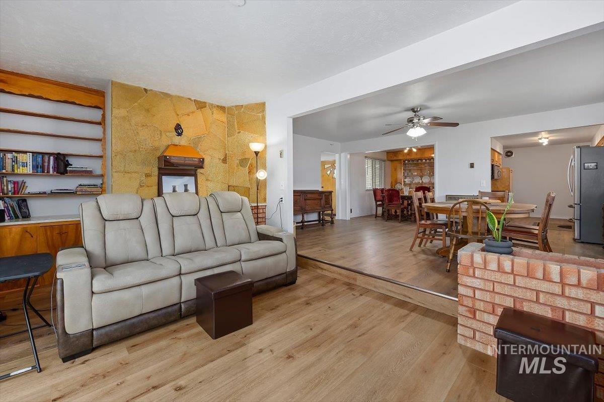 2012 21st Street Heyburn, ID 83336 - Photo 22 of 38 Living room featuring hardwood / wood-style flooring and a ceiling fan