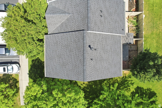 984 Independence Avenue Provo, UT 84604 - Photo 12 of 19 Grey shingle roof featuring a visible ridge line and multiple vents