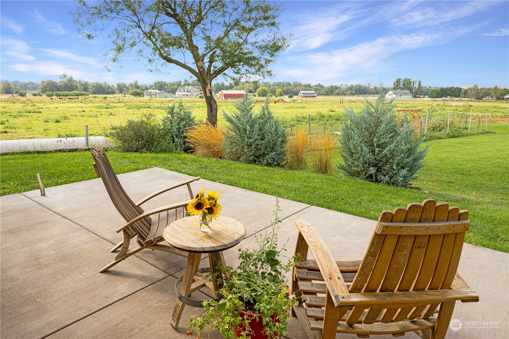132 Swegle Road Walla Walla, WA 99362 - Photo 3 of 40 a view of a lake with furniture and garden