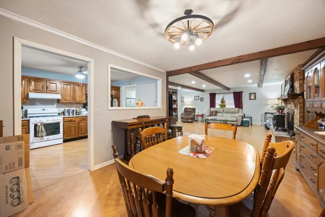a kitchen with stainless steel appliances granite countertop a refrigerator sink and cabinets