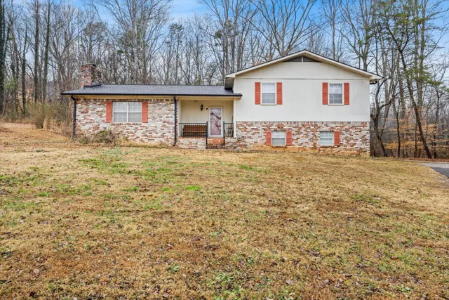 a house with trees in the background