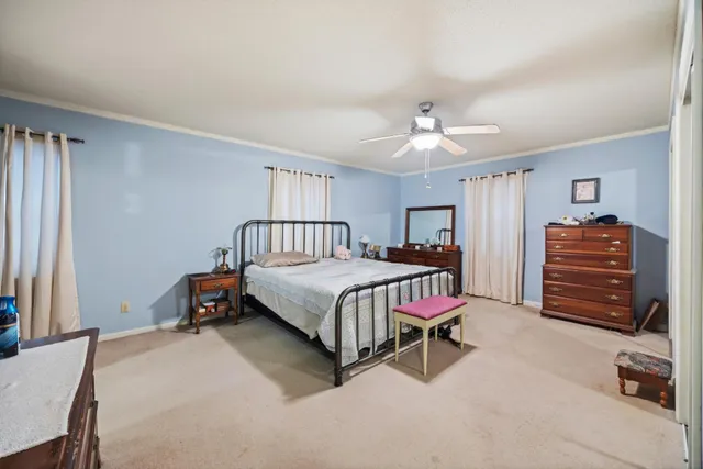 a bed room with a bed and a mirror