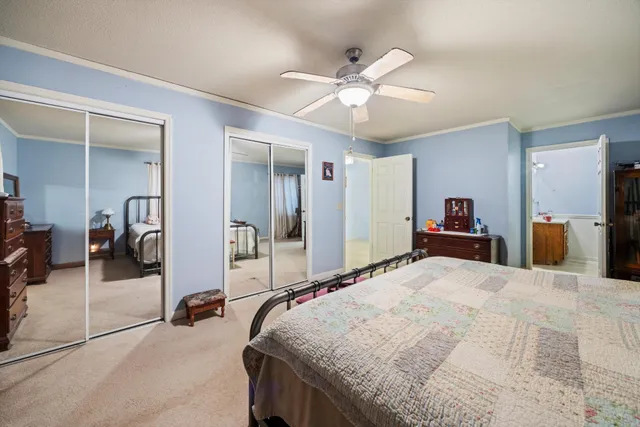 a view of a storage & utility room with a fan