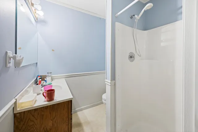 a bedroom with a bed and furniture