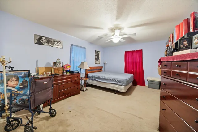 a bed room with a bed and a book shelf