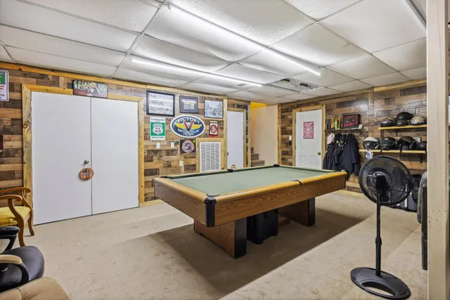 a living room with lots of furniture and a chandelier