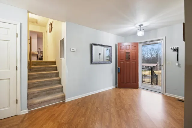 a view of a livingroom with a flat screen tv and outdoor space