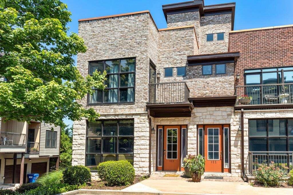 a view of a brick building with many windows