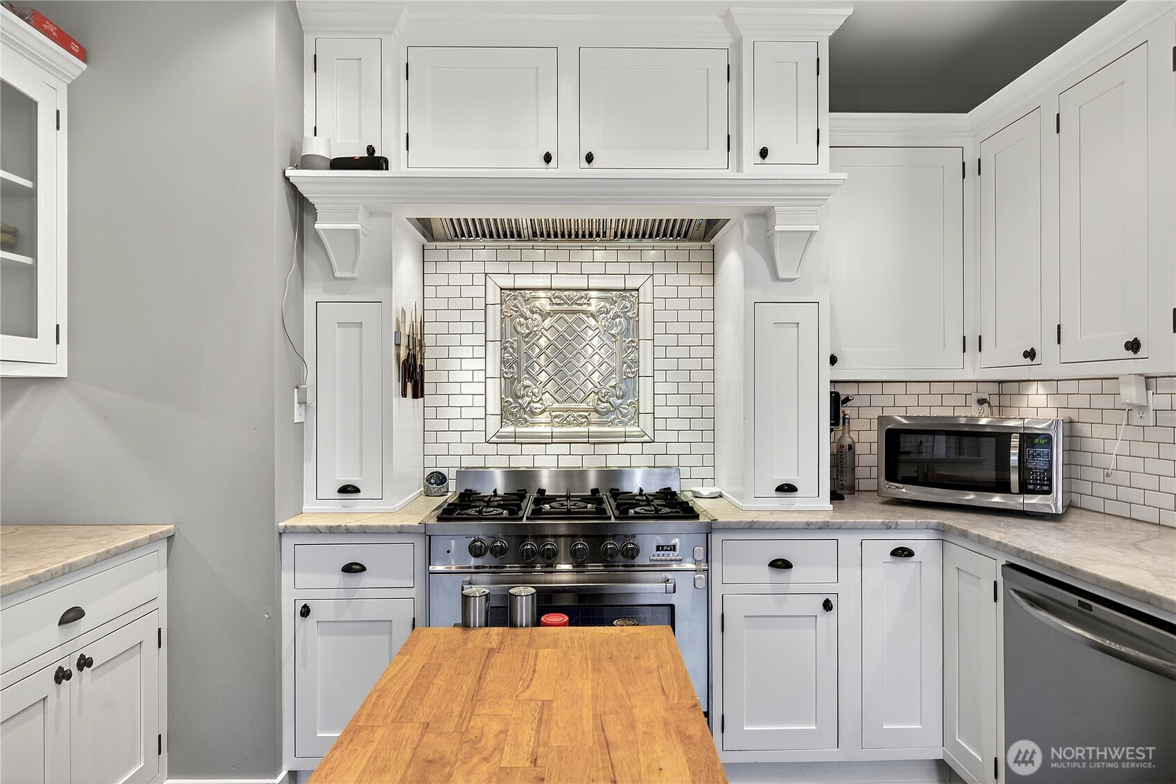 2120 12th Street Anacortes, WA 98221 - Photo 22 of 40 a kitchen with stainless steel appliances white cabinets and a sink