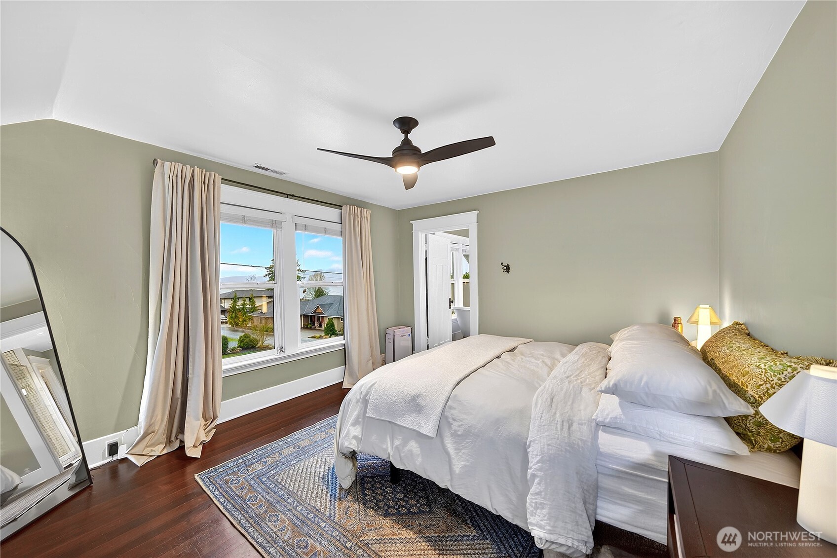 2120 12th Street Anacortes, WA 98221 - Photo 26 of 40 a bedroom with a bed and a large window