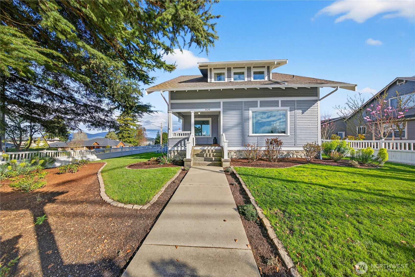 2120 12th Street Anacortes, WA 98221 - Photo 4 of 40 a view of a house with garden and a tree