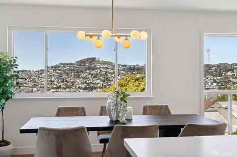 a view of dining room with furniture and chandelier