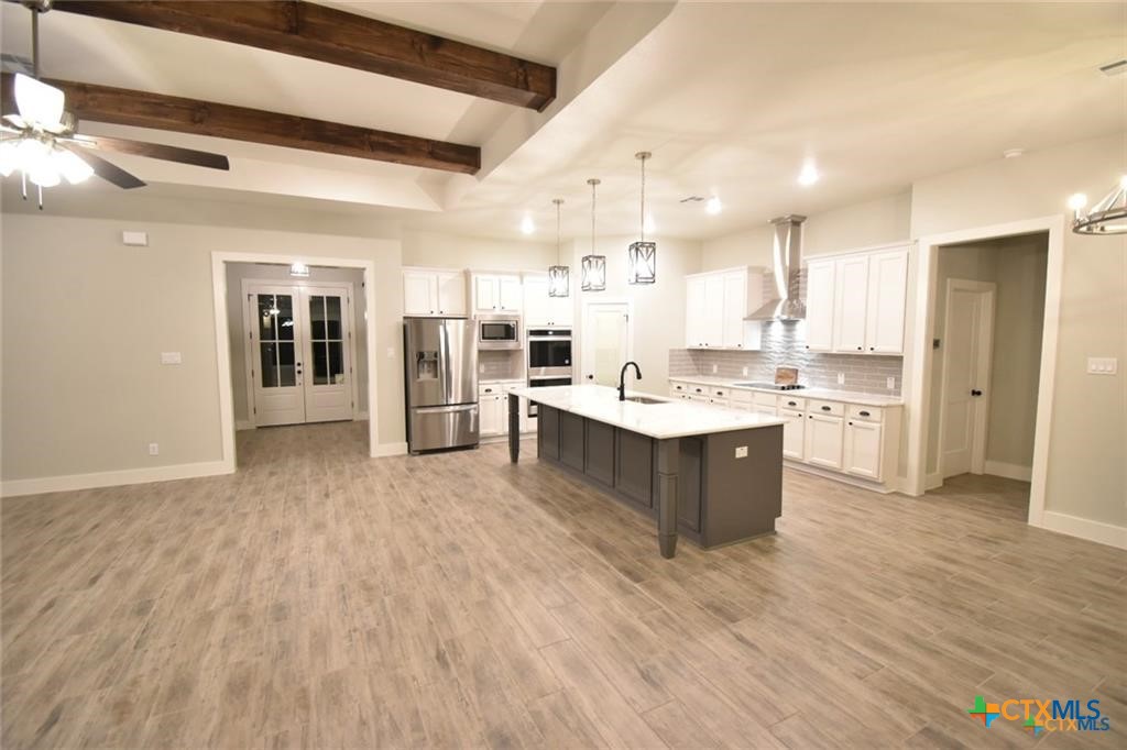 Tbd Tbd River Belton, TX 76513 - Photo 4 of 14 a large kitchen with a large counter top a sink stainless steel appliances and cabinets