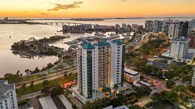 a living room with furniture a rug and a chandelier