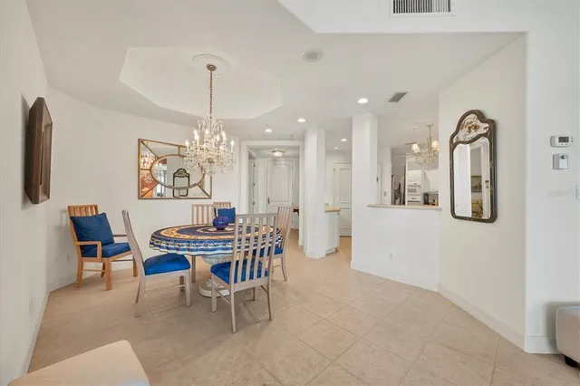 a kitchen with a sink a refrigerator and cabinets