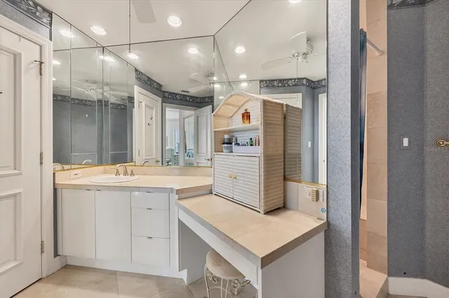 a living room with furniture a lamp and a potted plant
