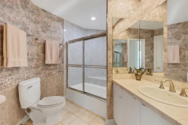 a view of a dining room with furniture wooden floor and a chandelier