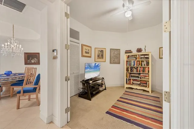 a bedroom with a table and a window