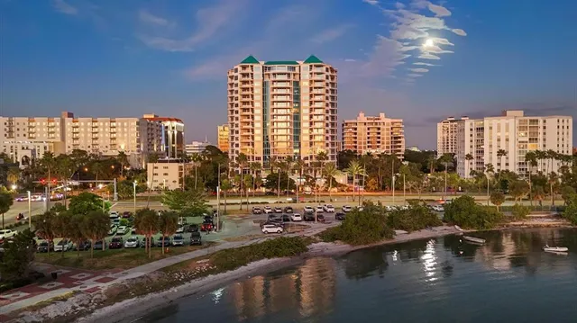 a view of a livingroom with lounge chair and a large window