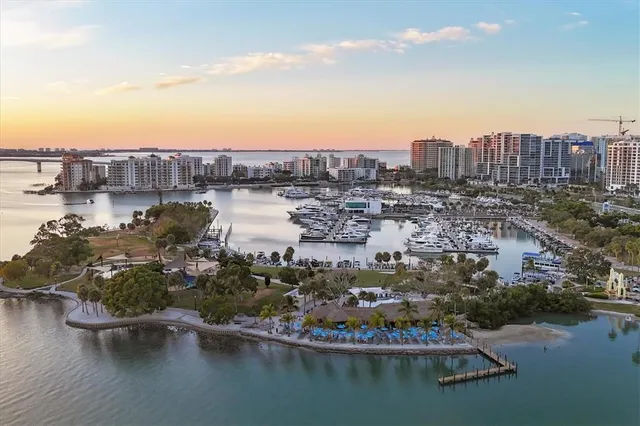 a bedroom with a bed and a wall painting