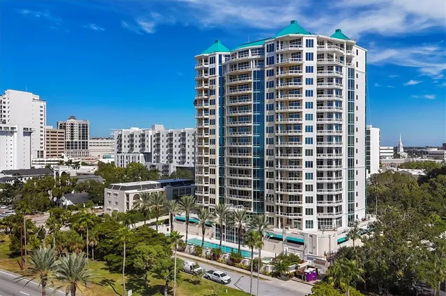 a view of a swimming pool with a lounge chairs