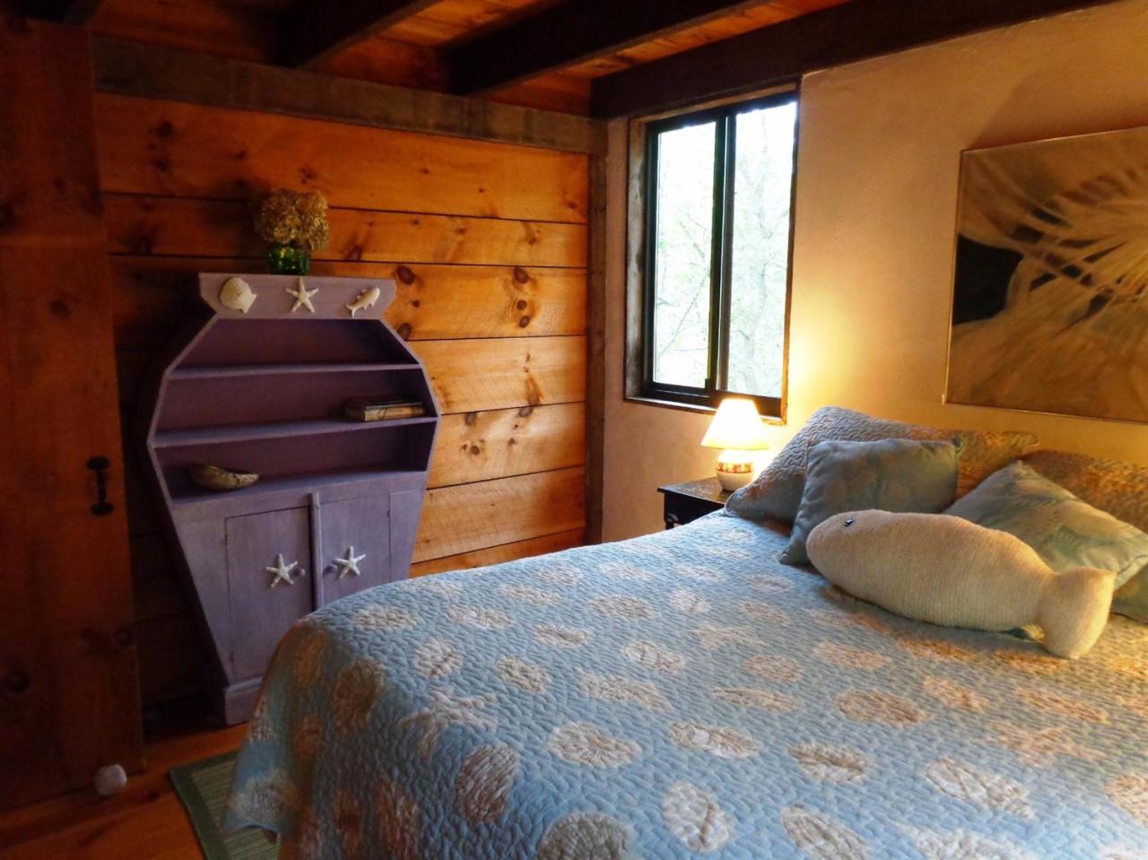 200 Gull Pond Road Wellfleet, MA 02667 - Photo 19 of 35 a bedroom with a bed and window