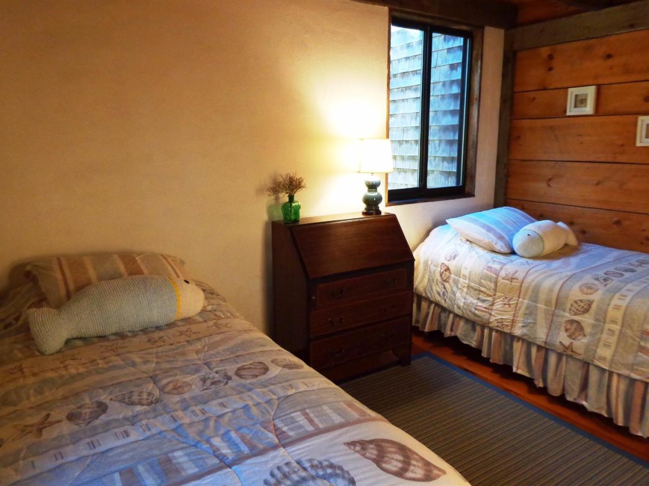 200 Gull Pond Road Wellfleet, MA 02667 - Photo 21 of 35 a bedroom with a bed and window