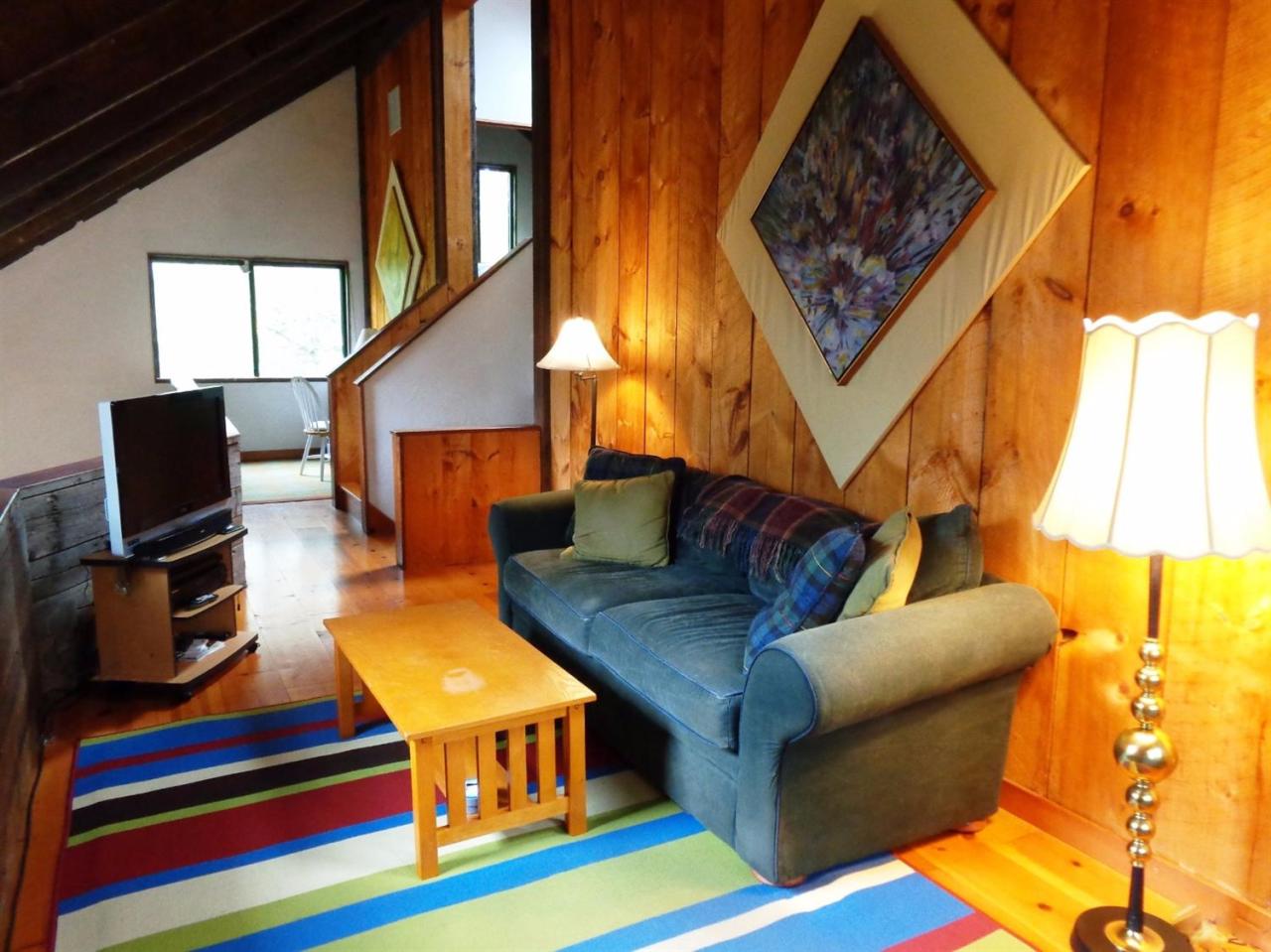 200 Gull Pond Road Wellfleet, MA 02667 - Photo 25 of 35 a living room with furniture and a flat screen tv