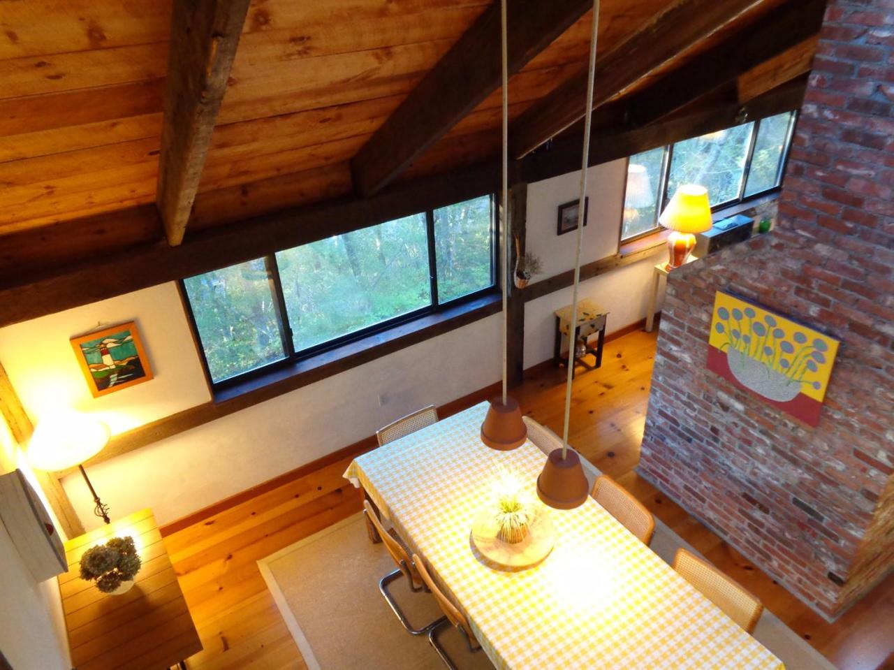 200 Gull Pond Road Wellfleet, MA 02667 - Photo 26 of 35 a bathroom with a sink a toilet and a shower curtain