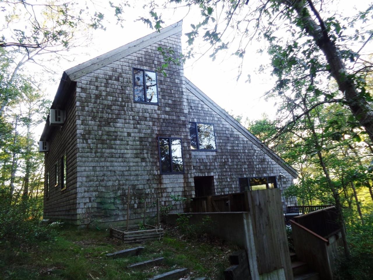 200 Gull Pond Road Wellfleet, MA 02667 - Photo 33 of 35 a backyard of a house with lots of green space