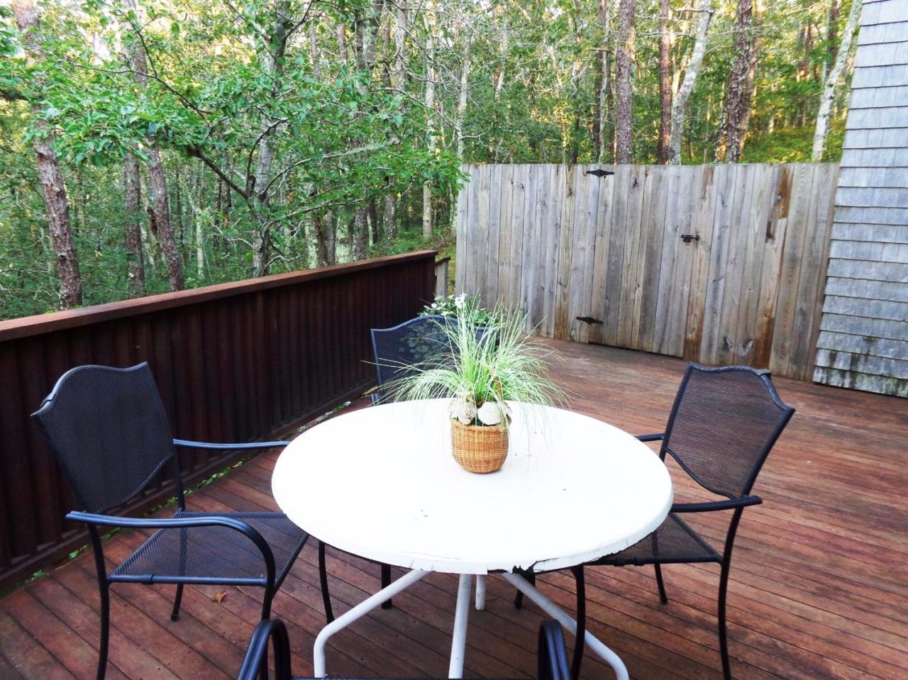 200 Gull Pond Road Wellfleet, MA 02667 - Photo 4 of 35 a outdoor dining space with furniture and wooden floor
